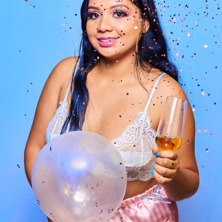 Kaveri Mehta, Lead Design Curator at ClearHarborView, reviewing corporate floral arrangements